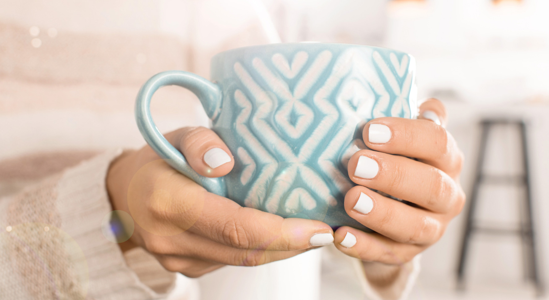 Holding a cup of tea. Image - Canva